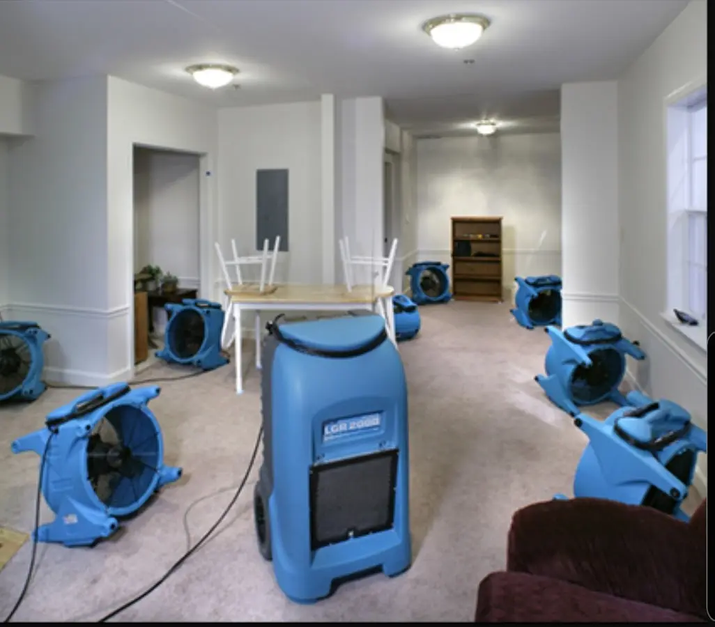 Air movers and dehumidifier setup for Water Damage Restoration in Ward